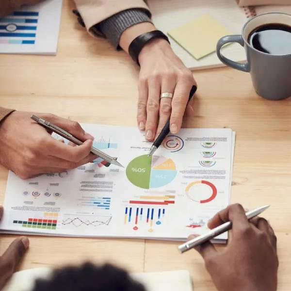 Team reviewing charts and graphs on a business report